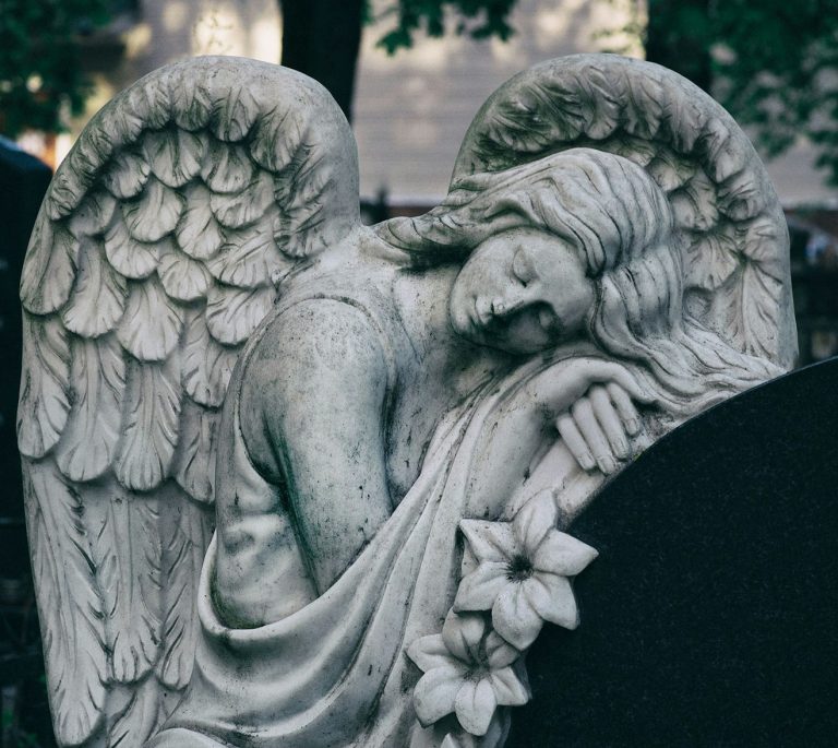 gray scale photo of angel statue